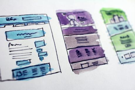 A sketch/watercolor of a website design on paper