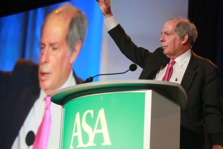 Bob Blancato waving from behind a podium at ASA Conference