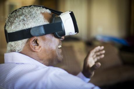 Older man using virtual reality 