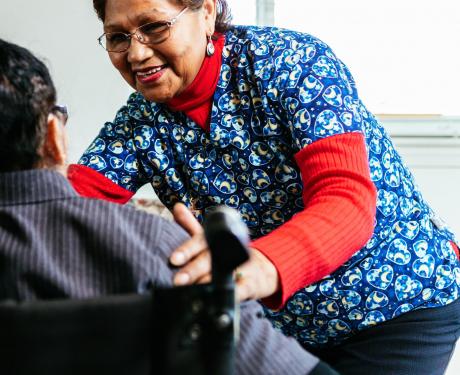 An NDWA member cares for an older adult at home.