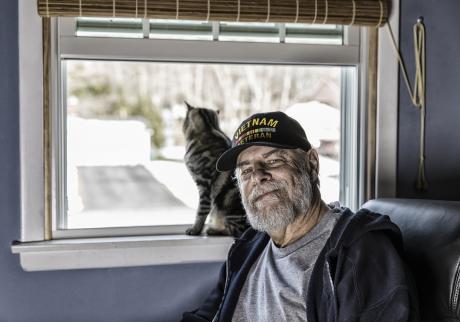 Vietnam veteran in his home with his cat
