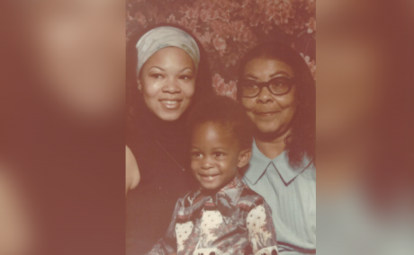 Najja Orr and a young boy with his mother and grandmother