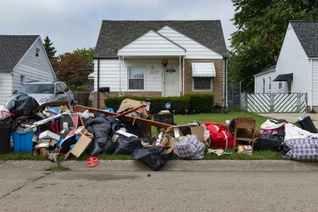 An evicted home with belongs piled on the curb