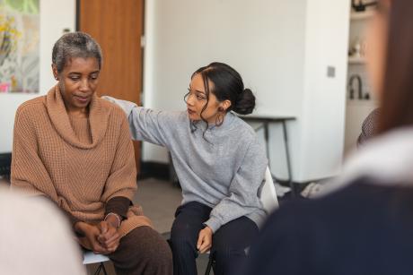 Woman getting support in a group therapy session