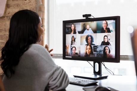 Woman at computer on video call with a group