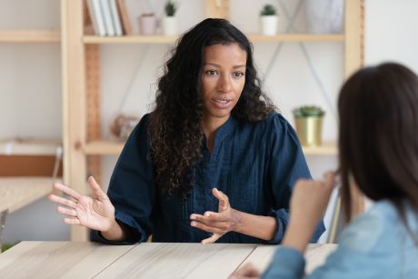 Confident woman mentoring a colleague