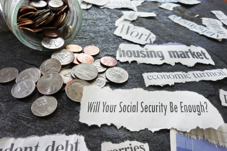 Photo of coins and newspaper headlines about Social Security