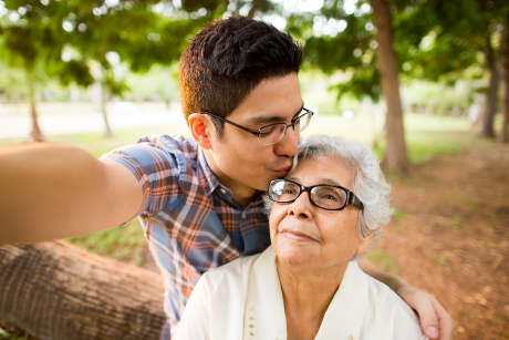Youth caregiver takes a selfie with his grandmother