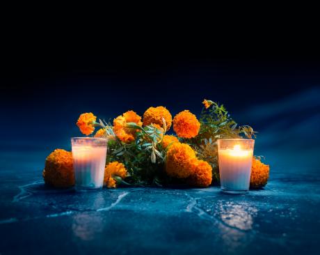 Candles burning with marigolds, death
