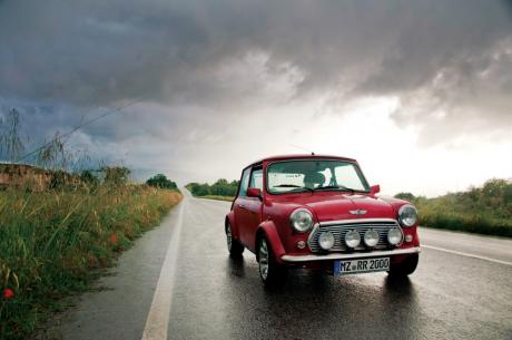 Mini Cooper on a slick road, cloudy day