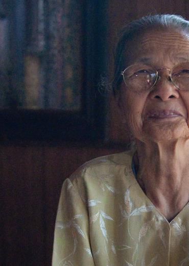A portrait of an older Asian woman